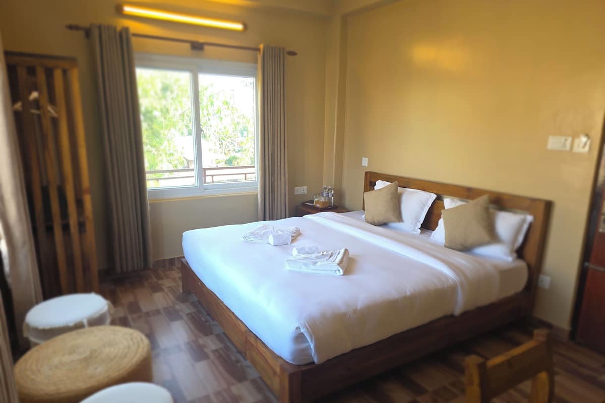 Deluxe Double Room, Balcony, Mountain View | In-room safe, laptop workspace, free WiFi