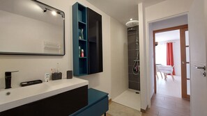 Shower, hair dryer, towels, soap