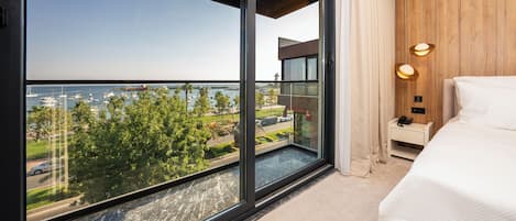 Deluxe Suite, Balcony, Sea View | In-room safe, desk, laptop workspace, free WiFi