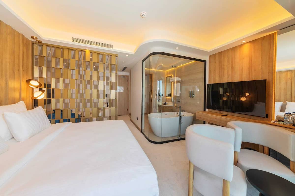 Deluxe Suite, Balcony, Sea View | In-room safe, desk, laptop workspace, free WiFi