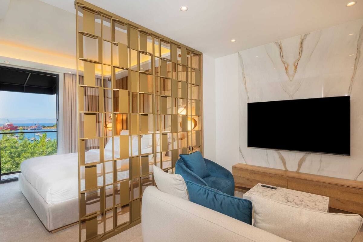 Deluxe Suite, Balcony, Sea View | In-room safe, desk, laptop workspace, free WiFi