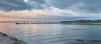 Walk to Rock Harbor Beach from your spacious Orleans coastal retreat