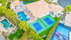 An aerial view of a resort with multiple swimming pools, tennis courts, and lush landscaping. - 0.4 Acre- Indio Sapphire Oasis with Game Room (Indio)