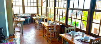 This room is a bunk room with two single bunk beds. The bathroom and showers are shared with the two other bunk rooms . The room has a great view of the village square.