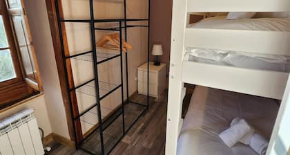 This room is a bunk room with two single bunk beds. The bathroom and showers are shared with the two other bunk rooms . The room has a great view of the village square.