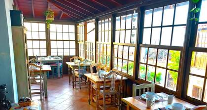 This room is a bunk room with two single bunk beds. The bathroom and showers are shared with the two other bunk rooms . The room has a great view of the village square.