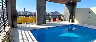 Moderna Suite GPT with a swimming pool and parking