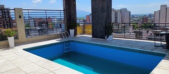Moderna Suite GPT with a swimming pool and parking