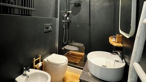 A compact, modern bathroom with a large mirror, two sinks, a shower, and a toilet. - Comfortable newly renovated room Isola/Dergano area (Milano)