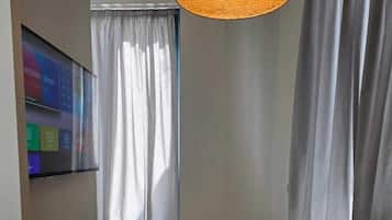 Luxury Suite, Sea View | Laptop workspace, blackout curtains, iron/ironing board
