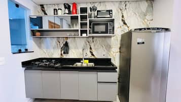 Fridge, microwave, stovetop, coffee/tea maker