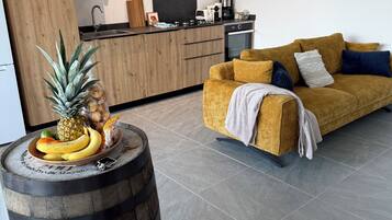 Apartamento superior, 2 quartos, 2 banheiros, vista para o jardim | Área de estar