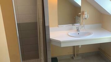 Shower, hair dryer, towels, toilet paper