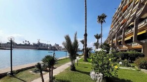 A beachfront hotel with a pool, palm trees, and a clear view of the sea. - 24/7 electricity Seaview studio with beach access (Jabal Lubnan)