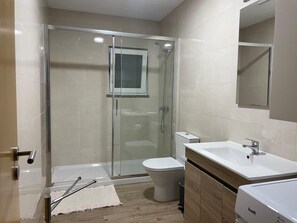 Shower, hair dryer, towels, soap