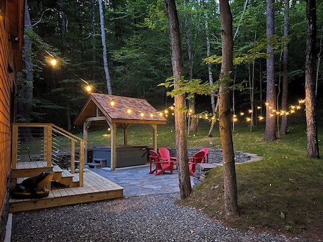 Terrace/patio. Escape to this private and peaceful tiny home with hot tub in Sharon, VT!