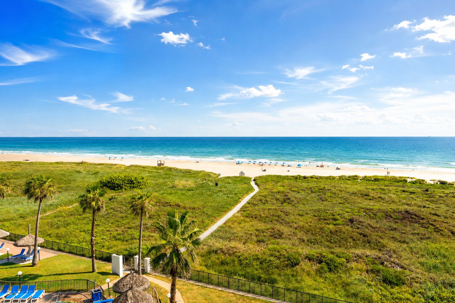 On the beach, sun loungers, beach towels