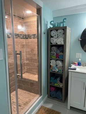Shower, towels, soap, toilet paper