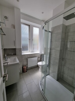 Shower, hair dryer, towels, soap