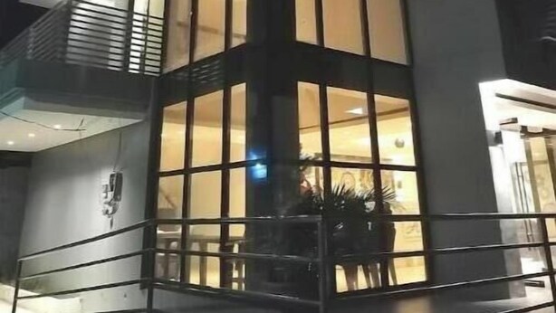 A modern building with large windows and a balcony. - Hotel Rupert A -Deluxe Suite King Bedroom (Aurora)