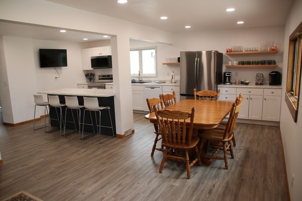 Spacious kitchen and dining area with coffee bar.