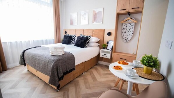 Standard Double Room | Desk, laptop workspace, blackout drapes, iron/ironing board