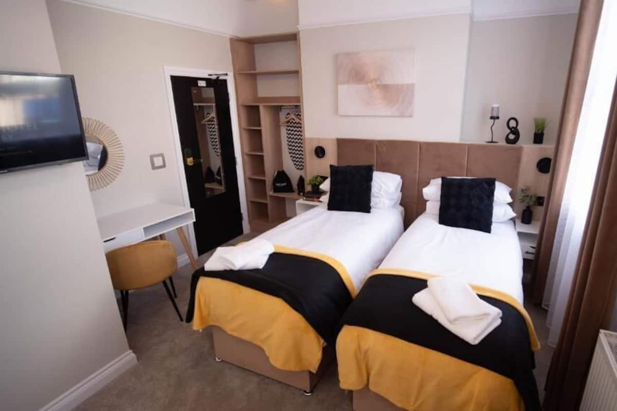 Standard Double Room | Desk, laptop workspace, blackout drapes, iron/ironing board