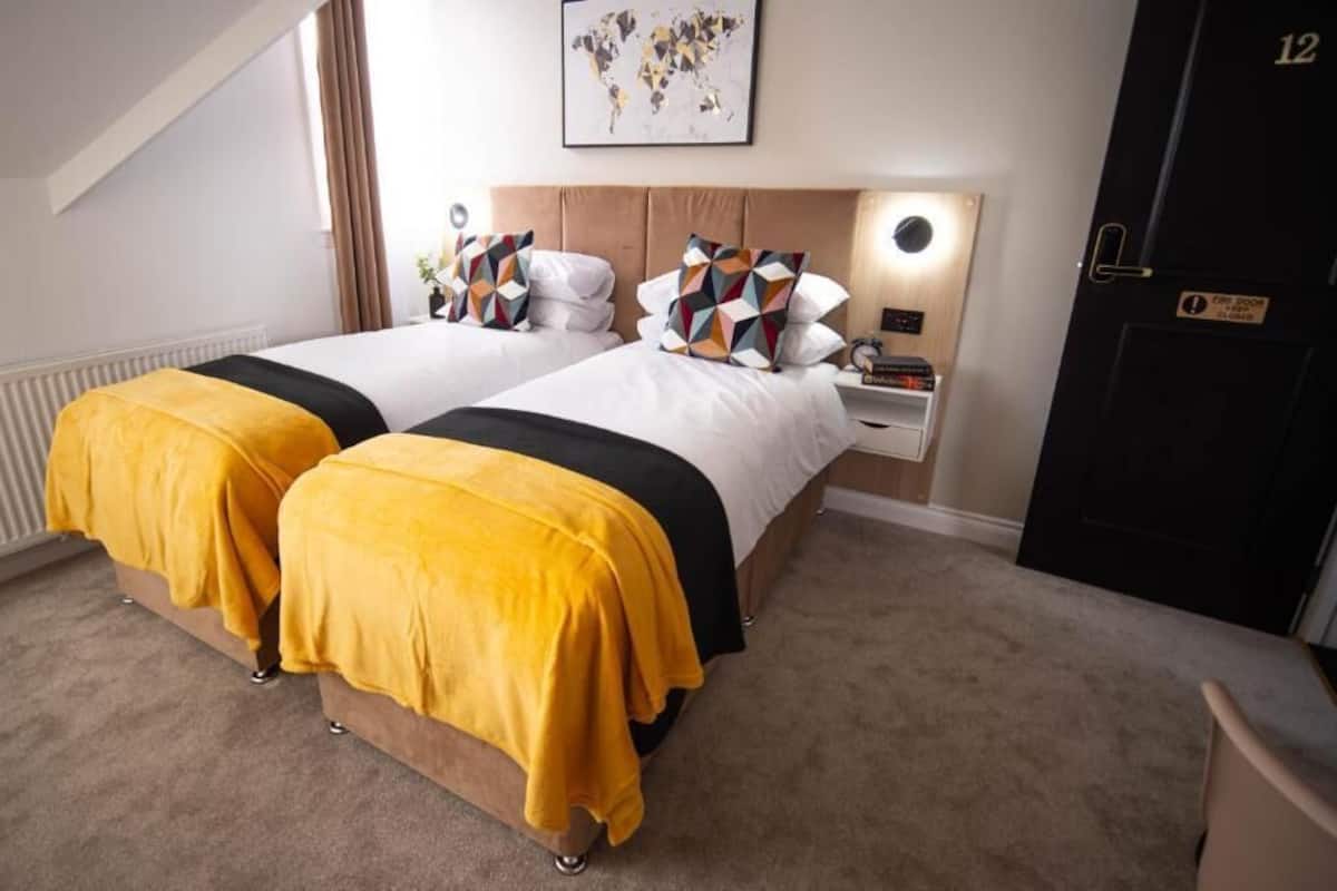 Standard Double or Twin Room | Desk, laptop workspace, blackout drapes, iron/ironing board