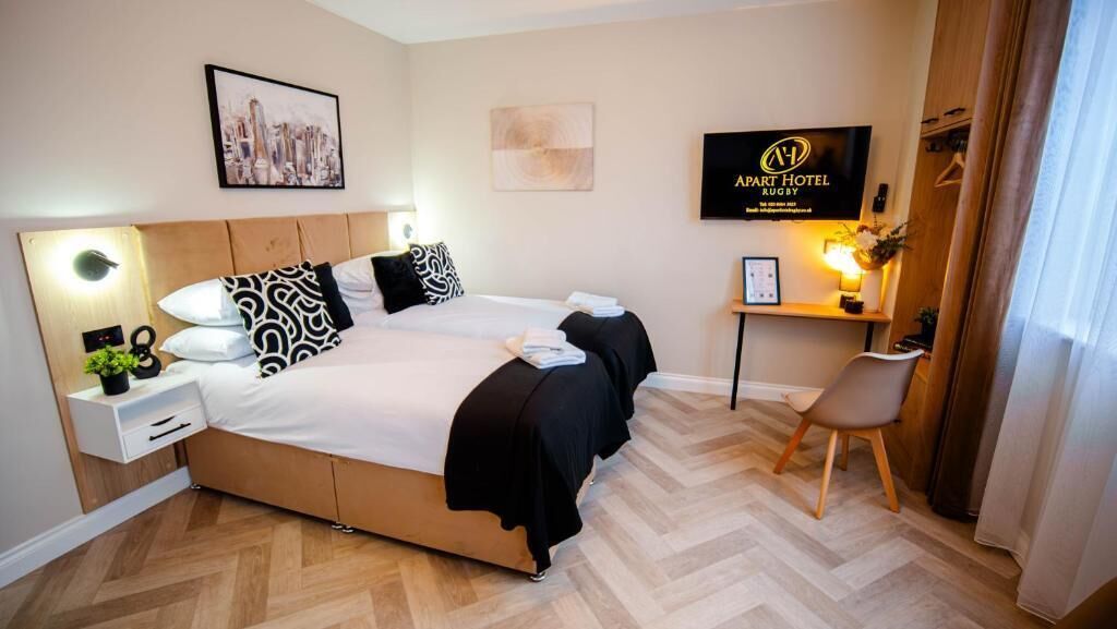 Deluxe Double or Twin Room | Desk, laptop workspace, blackout drapes, iron/ironing board