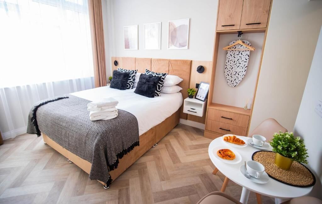 Standard Double Room | Desk, laptop workspace, blackout drapes, iron/ironing board