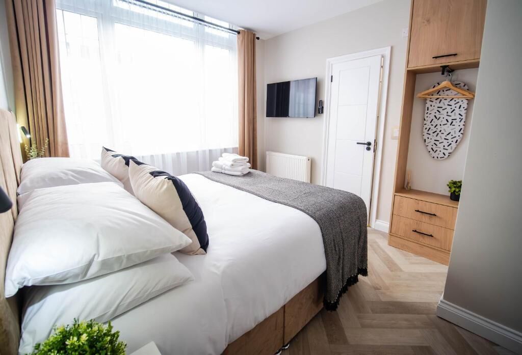 Economy Double Room | Desk, laptop workspace, blackout drapes, iron/ironing board