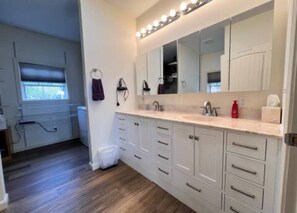 Shower, hair dryer, towels, toilet paper