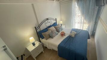 1 bedroom, desk, iron/ironing board, travel crib