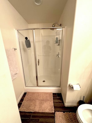 Shower, hair dryer, towels, soap