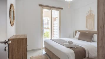 Apartamento, 1 quarto, cozinha, vista para a cidade | Cortinas blackout, ferros/tábuas de passar roupa, Wi-Fi de cortesia