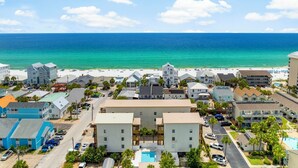 A coastal hotel with a pool, beach view, and multiple buildings. - 18+ can book! Panama City Beach, Holiday Beach, The ole MTV house Neighborhood (Panama City Beach)