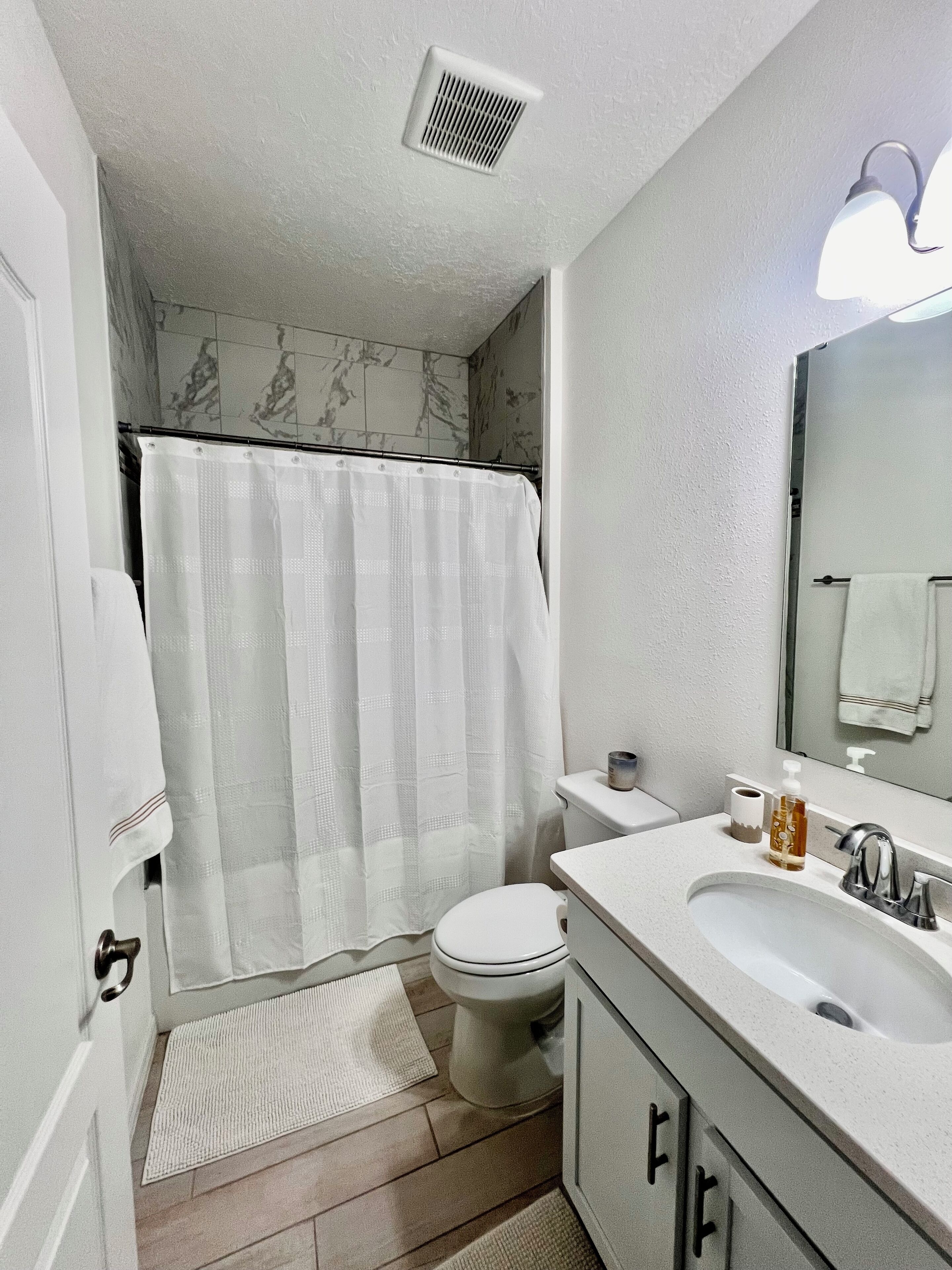 Shower, towels, soap, toilet paper