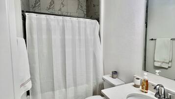 Shower, towels, soap, toilet paper