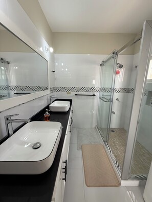 Shower, hair dryer, towels, soap