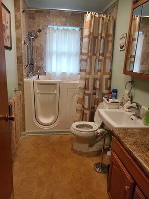 Jetted bath, hair dryer, towels, soap