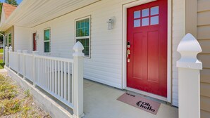 A house with a red door, white picket fence, and a doormat with "See you" written on it. - Country lifestyle w/ the beaches (Bolivia)