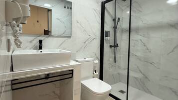 Shower, hair dryer, towels, soap