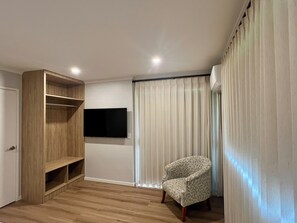 Deluxe Apartment, Courtyard View | Desk, laptop workspace, iron/ironing board, free WiFi