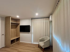Deluxe Apartment, Courtyard View | Desk, laptop workspace, iron/ironing board, free WiFi