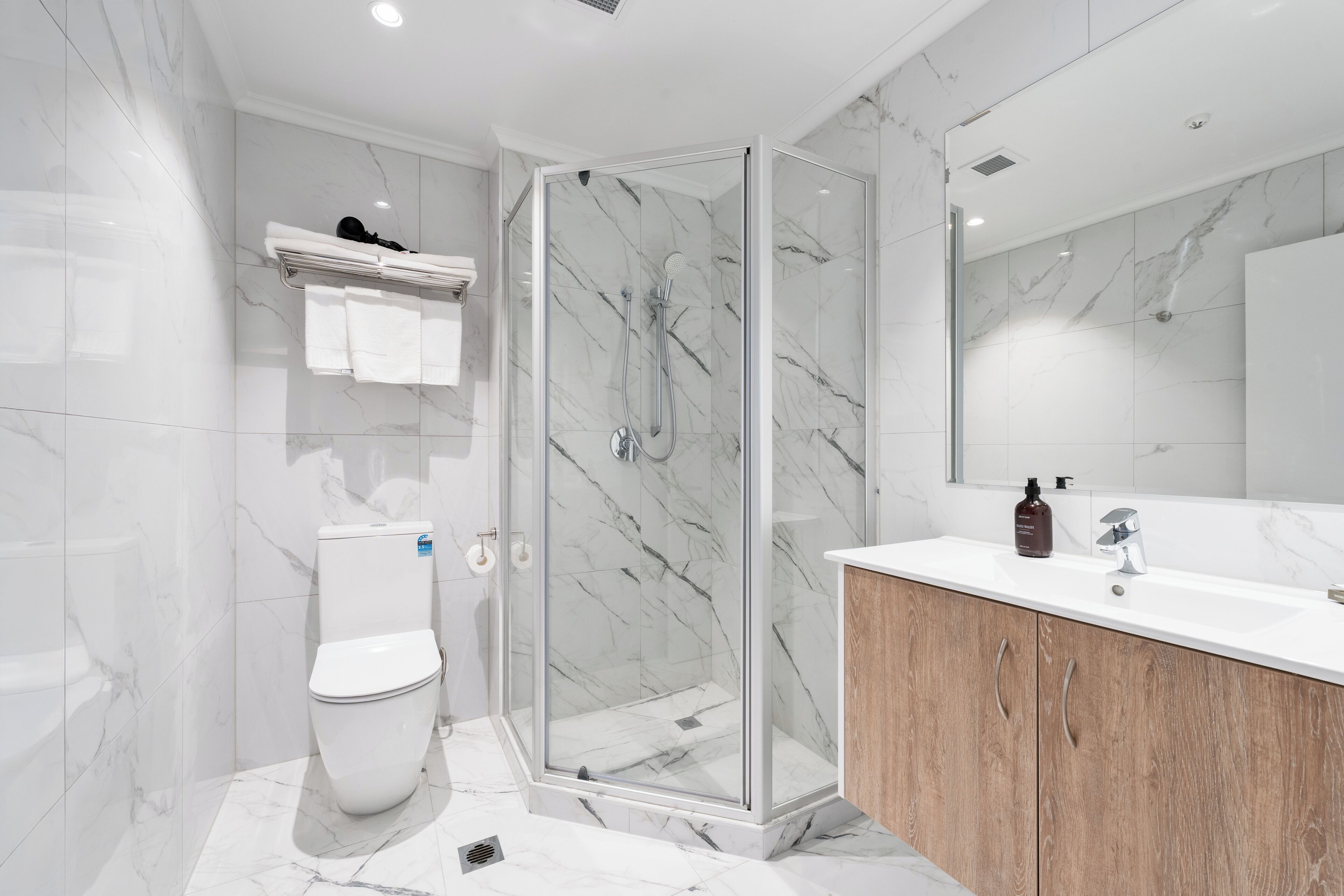 Shower, hair dryer, towels