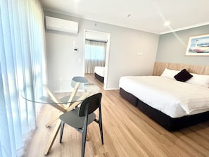 Deluxe Apartment, Courtyard View | Bathroom | Shower, hair dryer, towels