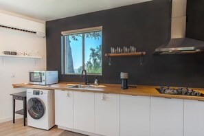 Fridge, microwave, stovetop, coffee/tea maker