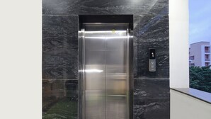 An elevator with a metallic interior and a control panel on the wall. - Fabhotel Yendluri'S Abode (Hyderabad)