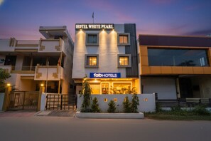 A modern hotel with a prominent sign reading "HOTEL WHITE PEARL" and "fabHOTELS" below. - Fabhotel White Pearl (Indore)