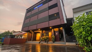 A modern building with a sign reading "Fab Hotels". It features a multi-story structure with a flat roof and a series of windows. - Fabhotel Pk Residency (Ernakulam)
